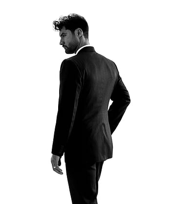 black and white, man in suit, formal suit, studio setting, sophisticated portrait, black and white portrait, man posing, studio portrait, black suit, white background, professional photography