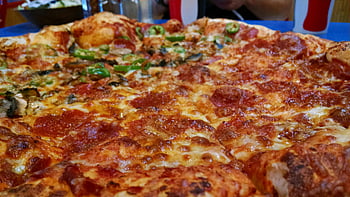 Brown and Red Pepperoni Pizza, mouthwatering close-up, pepperoni and cheese pizza, pizza slice, ready to enjoy, delicious pizza, cheesy pizza, pepperoni pizza, pizza toppings, pizza crust, pizza restaurant