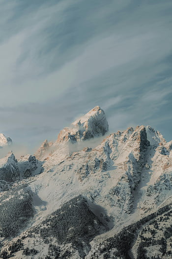 snow-covered mountains, mountain peaks, winter landscape, aerial view, clear sky, snow on mountains, breathtaking view, winter scenery, mountain range, snowy peaks, winter mountains