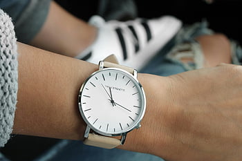 beige strap watch, silver round watch, analog watch, minimalist watch, elegant watch, simple watch, Adidas Superstar, white and black sneakers, wristwatch, stylish watch, minimalist design