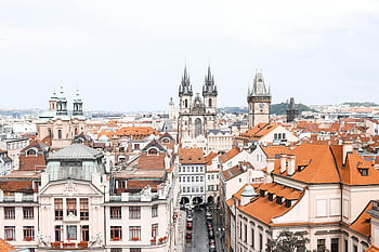 Prague, aerial view, Tyn Church, historical architecture, cityscape, drone shot, Prague skyline, European city, iconic landmarks, red roofs, Czech Republic