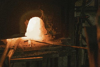 blacksmith forge, glowing furnace, intense heat, craftsmanship, vibrant tools, hot furnace, blacksmith tools, forge workshop, metalworking, traditional craft, artisanal skills