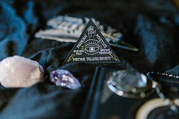 triangle sign, crystals, black surface, fortune telling, mystic emblem, dark surface, modern mystics, destiny revealed, fortune tellers society, close-up, patch