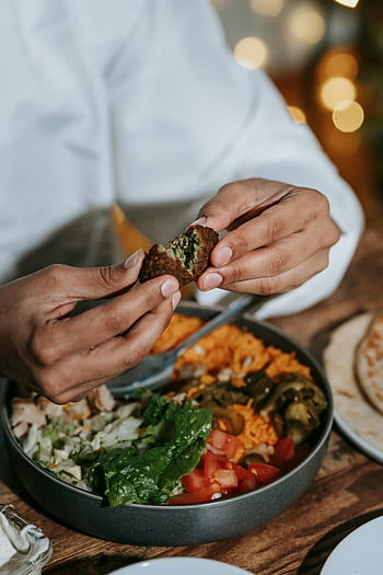 falafel, healthy meal, vegetables, salad, man eating, hands breaking, delicious plate, vegetarian food, middle eastern cuisine, healthy eating, fresh ingredients