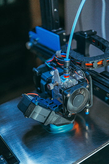 3Dプリンタ、 押出機ヘッド、 ワークショップの設定、 機械部品、 詳細なビュー、 3Dプリント、 ワークショップ機器、 産業用機械、 印刷技術、 機械コンポーネント、 ワークショップツール