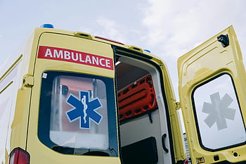 ambulance, low angle shot, medical interior, emergency response, yellow ambulance, open doors, medical equipment, emergency vehicle, rescue vehicle, healthcare transport, paramedic service