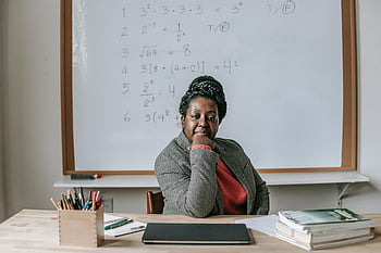 confident black woman, classroom, professional teacher, whiteboard, equations, math teacher, education, teaching, confident teacher, classroom setting, black educator
