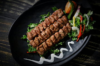 kebab, grilled kebab, fresh salad, black plate, food lovers, succulent kebab, kebab on a plate, grilled meat, salad accompaniment, plate presentation, kebab dish