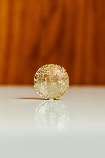 Bitcoin, golden Bitcoin, shiny white surface, wooden background, cryptocurrency, digital currency, Bitcoin display, Bitcoin coin, Bitcoin reflection, Bitcoin art, Bitcoin symbol