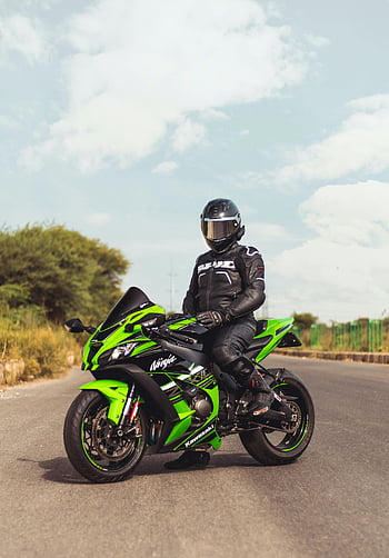 Kawasaki Ninja, green motorbike, black helmet, motorcyclist, open road, New Delhi, motorcycle, riding, outdoor, sports bike, safety gear