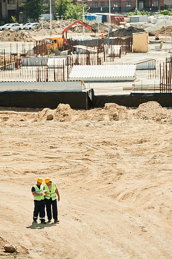 aerial shot, construction site, workers, safety gear, equipment, aerial view, construction workers, building site, construction equipment, construction safety, construction site aerial