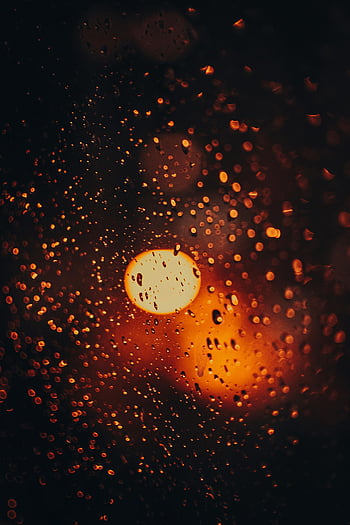 light reflection, window, warm bokeh, raindrops on glass, glowing texture, close-up, abstract, warm light, raindrops, bokeh effect, texture