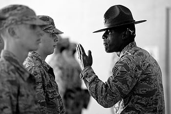 military training, drill instructor, group of men, military uniform, camouflage uniform, military command, leadership, training session, military personnel, black and white photo, military discipline