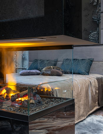 cozy bedroom, bright fireplace, modern decor, stylish bedroom, warm fireplace, contemporary bedroom, cozy interior, bedroom design, modern bedroom, fireplace decor, cozy ambiance