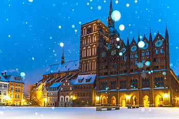 Old Market Square, Stralsund Town Hall, snowy winter night, Germany, historic architecture, winter landscape, Stralsund, town hall, night scene, snow-covered buildings, blue hour