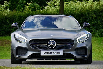 Gray Mercedes-Benz AMG, front view, luxury car, natural backdrop, Mercedes-Benz AMG, outdoor setting, high-performance vehicle, sleek design, automotive photography, car enthusiasts, modern automobile