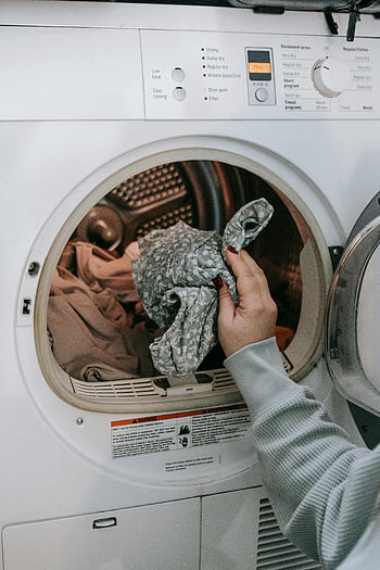 washing machine, loading clothes, domestic chores, daily routine, close-up, laundry, household tasks, woman, appliance, laundry room, chores