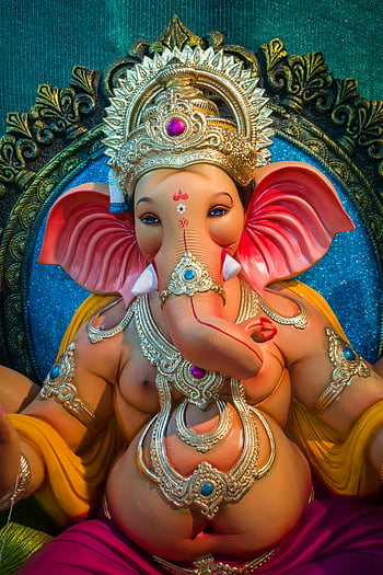 Ganesha, idol, statue, close-up, vibrant, cultural artistry, detailed shot, rich culture, ornate design, Hindu deity, elephant god
