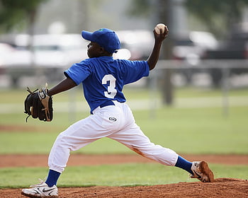 youth baseball, boy pitching, blue and white jersey, sunny day, baseball game, young player, baseball field, sports action, outdoor sports, baseball pitcher, number 3 jersey