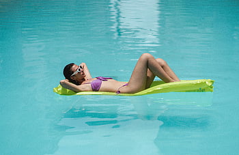 slim woman, water hammock, pool relaxation, young woman, bikini, float, serene pool, summer sun, swimwear, vacation, outdoor activity