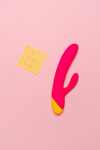 pink vibrator, sticky note, I love you, soft pastel backdrop, modern sex toy, playful message, adult product, intimate accessory, romantic gesture, personal pleasure device, vibrant colors