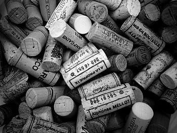 grayscale photography, cork lot, monochrome close-up, wine corks, intricate text, designs, assorted corks, detailed corks, black and white, wine bottle corks, cork collection