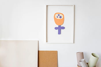 child's artwork, picture frame, colorful drawing, art supplies, minimalist indoor wall, framed art, children's art, creative space, wall decor, art display, indoor art