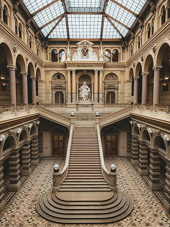 Wiener Justizpalast, majestic staircase, historic palace, Vienna, classic architecture, interior design, ornate details, glass ceiling, grand hall, European landmarks, architectural marvel