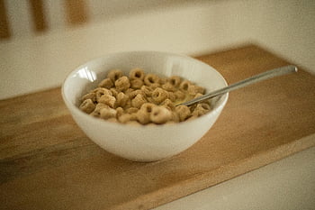 cereal, white ceramic bowl, spoon, honey-flavored cereal, healthy breakfast, bowl of cereal, white bowl, breakfast cereal, morning meal, cereal bowl, honey cereal