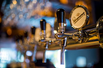 stainless steel beer dispenser, shiny beer tap, stylish bar, blurred background, beer tap, bar equipment, bar decor, beer serving, bar accessories, beer faucet, bar tap