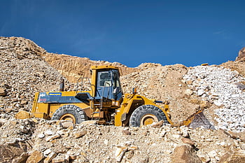 heavy machinery, mine, industrial bulldozer, quarry, rocky terrain, sunny, construction equipment, mining industry, earth mover, excavation, industrial vehicle