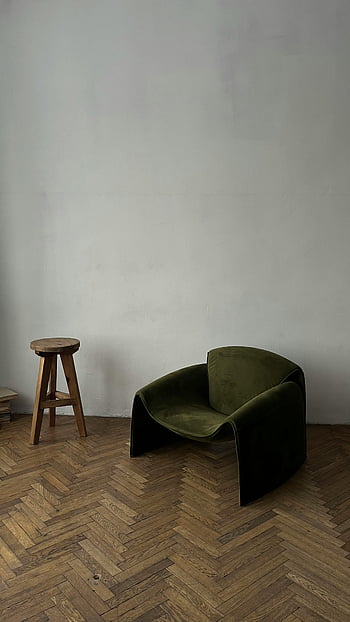 modern armchair, wooden parquet, minimalist interior, green armchair, wooden stool, parquet flooring, contemporary furniture, living room decor, modern furniture, interior design, green velvet chair
