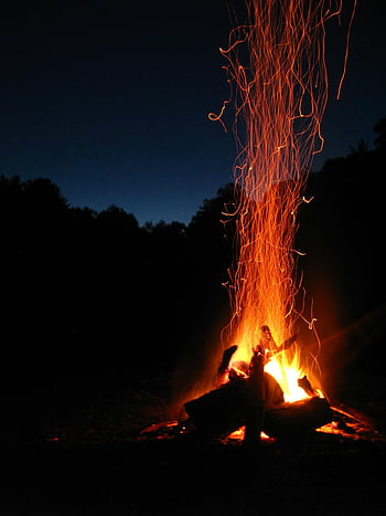 Bonfire, vibrant campfire, sparks rising, serene night, outdoor themes, night backdrop, campfire sparks, outdoor bonfire, night bonfire, fire sparks, night fire