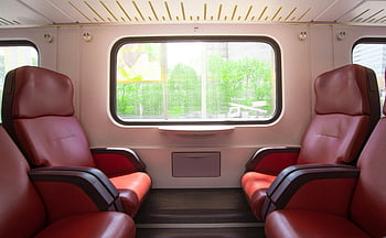 red leather armchair, train interior, red leather seats, large windows, comfortable travel, spacious train, train seats, travel experience, train cabin, red seats, train comfort