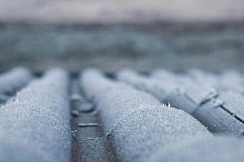 frosty roof shingles, winter atmosphere, icy grip, close-up photography, selective focus, frosty roof, cold atmosphere, roof rail, winter scene, icy roof, frosty texture