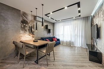 modernt vardagsrum, minimalistisk inredning, elegant belysning, snygga möbler, modern tv, mjuk soffa, matbord, ljust utrymme, rymlig rum, samtida design, hängande vägg -tv