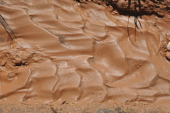 wet clay soil, rippled surface, natural patterns, soil textures, detailed view, clay texture, wet soil, natural clay, soil surface, clay patterns, earth textures