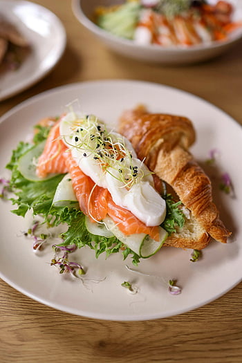 croissant, salmon, sandwich, sprouts, boiled egg, gourmet, fresh meal, plate, lettuce, cucumber, breakfast
