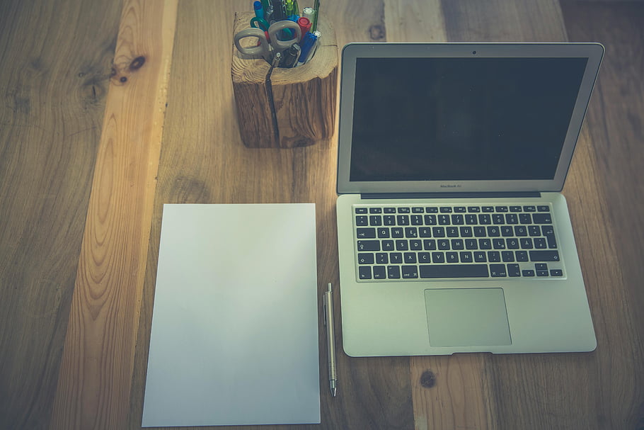 book Pro, brown wooden table, minimalist workspace, laptop, paper, stationery, wooden desk, desk setup, office desk, workspace setup, desk organization