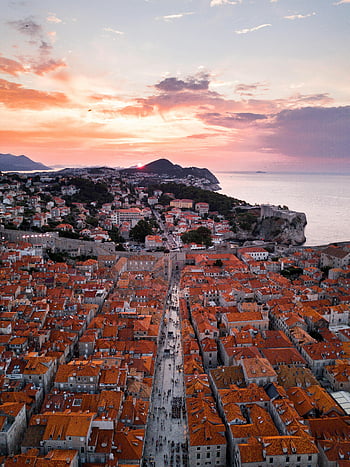 Dubrovnik, Old Town, aerial photography, red rooftops, sunset sky, Adriatic Sea, concrete buildings, brown roofs, stunning view, historic architecture, Croatia