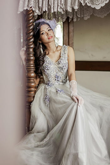 woman in white floral dress, beautiful bride, elegant bridal gown, indoor wedding photo, graceful pose, vintage wedding dress, lace veil, wedding portrait, bridal fashion, elegant wedding, indoor wedding setting