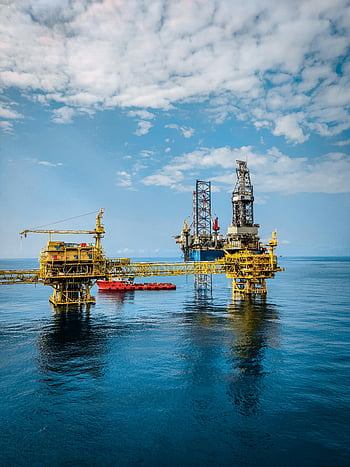 oil rig, offshore oil rig, clear sky, calm blue sea, vibrant oil rig, offshore platform, marine industry, oil extraction, ocean infrastructure, industrial structure, energy production