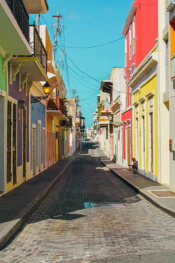 Old San Juan, Puerto Rico, colorful colonial architecture, vibrant streetscape, cobblestone street, colonial buildings, San Juan streets, Puerto Rico architecture, historic district, street paving, colonial charm