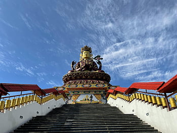 Maitreya Buddha, Pelling, Sikkim, giant statue, concrete stairs, clear blue sky, majestic statue, religious monument, prayer wheels, temple architecture, spiritual site
