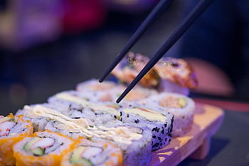 tilt-shift photography, Maki, sushi platter, chopsticks, fresh sushi rolls, delicious sushi, variety sushi, sushi rolls, Japanese food, sushi presentation, food photography