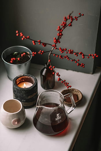 candle, jug of tea, windowsill, home decor, warm, inviting, candle light, potted plant, cozy, indoor, still life