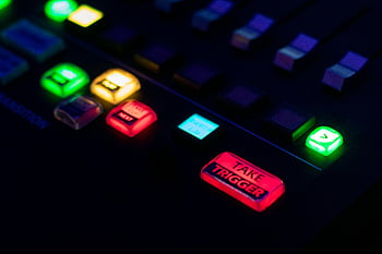 buttons in close up, vibrant console, illuminated buttons, technology themes, close-up photo, control panel, colorful buttons, tech equipment, electronic device, modern technology, interactive interface