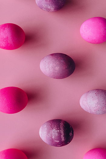 pink eggs, purple eggs, Easter eggs, colorful eggs, flat lay, pink surface, painted eggs, holiday decor, spring decoration, pastel colors, festive eggs