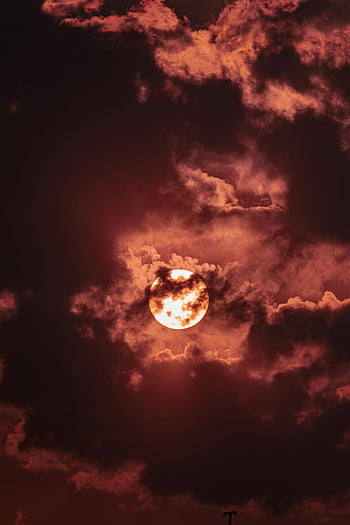 full moon, dark clouds, night sky, dramatic clouds, mystical mood, vivid full moon, shining moon, night scene, celestial view, atmospheric effect, moonlit night