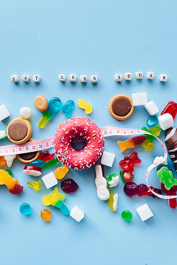 vaaleanpunainen ja valkoinen donitsi, sprinkles, sokerin vähentäminen, eloisa näyttö, munkkeja, karamelli, Syö vähemmän sokeria, mittanauha, nallekarkkeja, vaahtokarkkeja, terveellinen ruokavalio